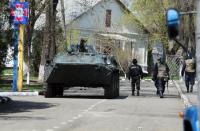 Ukrainian police guard the military base in the southeast city of Mariupol