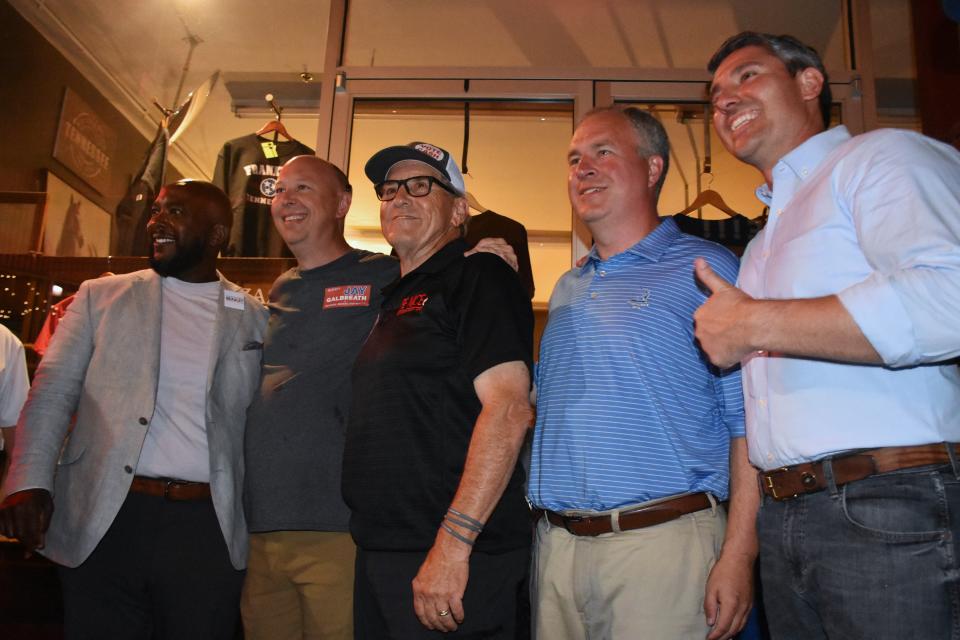 Winning school board candidates Drason Beasley (left), Jay Galbreath, Dan Cash and Josh Brown, plus county commission newcomer Brian Clifford (right), pose together at The Factory in Franklin, Tenn. where Republican campaign supporters gathered to watch election results flow in on Thursday, Aug. 4, 2022.