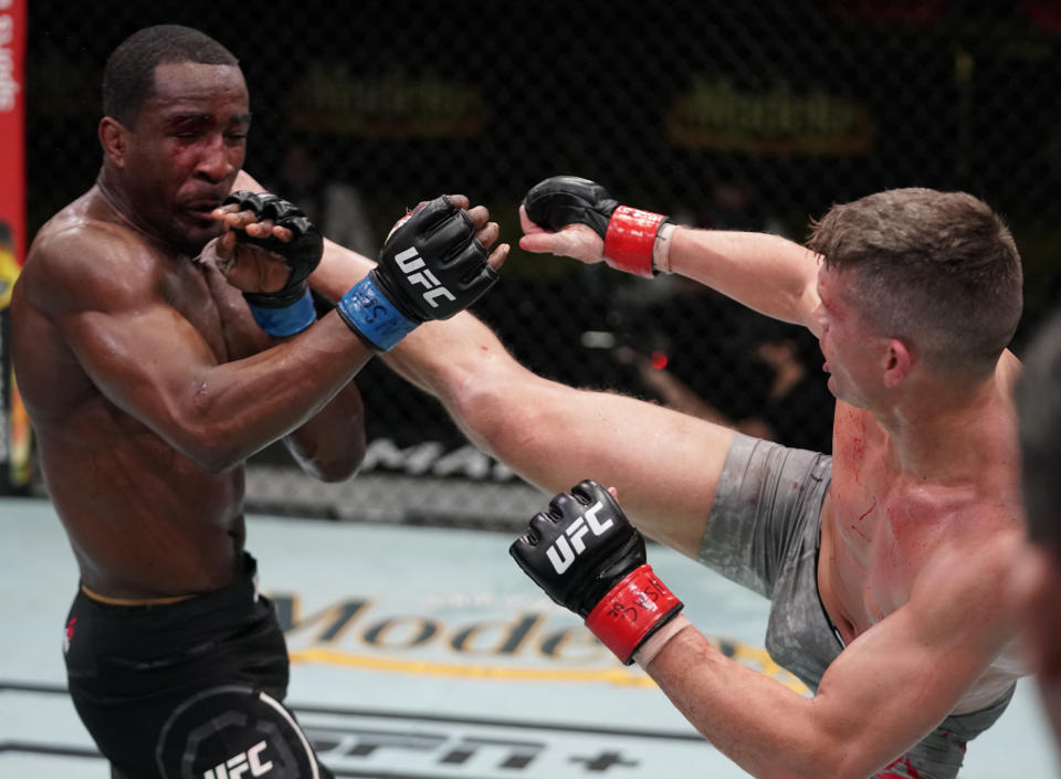 LAS VEGAS, NEVADA - DECEMBER 19: (R-L) Stephen Thompson kicks Geoff Neal in a welterweight fight during the UFC Fight Night event at UFC APEX on December 19, 2020 in Las Vegas, Nevada. (Photo by Cooper Neill/Zuffa LLC)