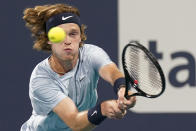 Andrey Rublev, of Russia, returns a shot from Sebastian Korda, of the United States, during the Miami Open tennis tournament Thursday, April 1, 2021, in Miami Gardens, Fla. (AP Photo/Wilfredo Lee)