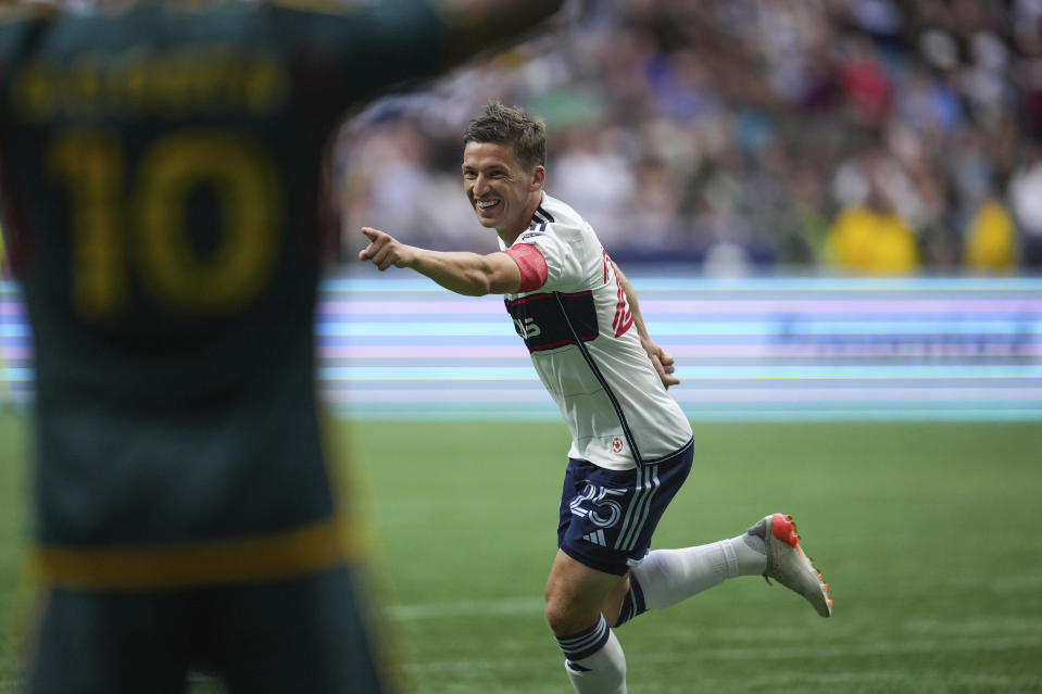 Vancouver Whitecaps' Ryan Gauld celebrates his first goal against the Los Angeles Galaxy, during the first half of an MLS soccer match Saturday, July 15, 2023, in Vancouver, British Columbia. (Darryl Dyck/The Canadian Press via AP)