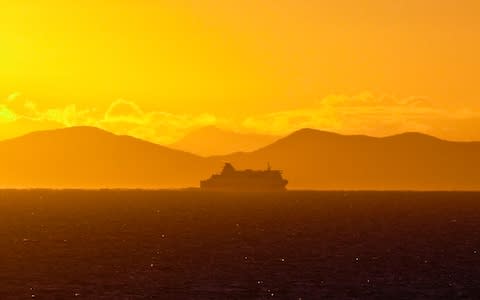 A cruise ship at sunset - Credit: ARNOLD H. DRAPKIN