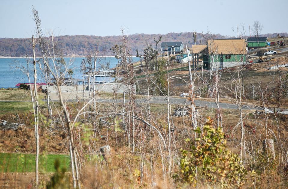 The formerly heavily-wooded area and shoreline at Kentucky Lake was changed by the December 2021 tornados in Gilbertsville, Ky. Original homes that were destroyed continue to be rebuilt.  Nov. 16, 2022.