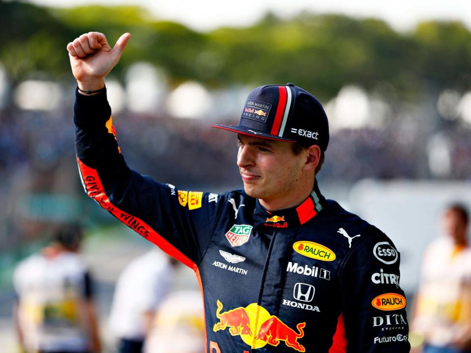 Max Verstappen celebrates winning pole at Interlagos: Getty