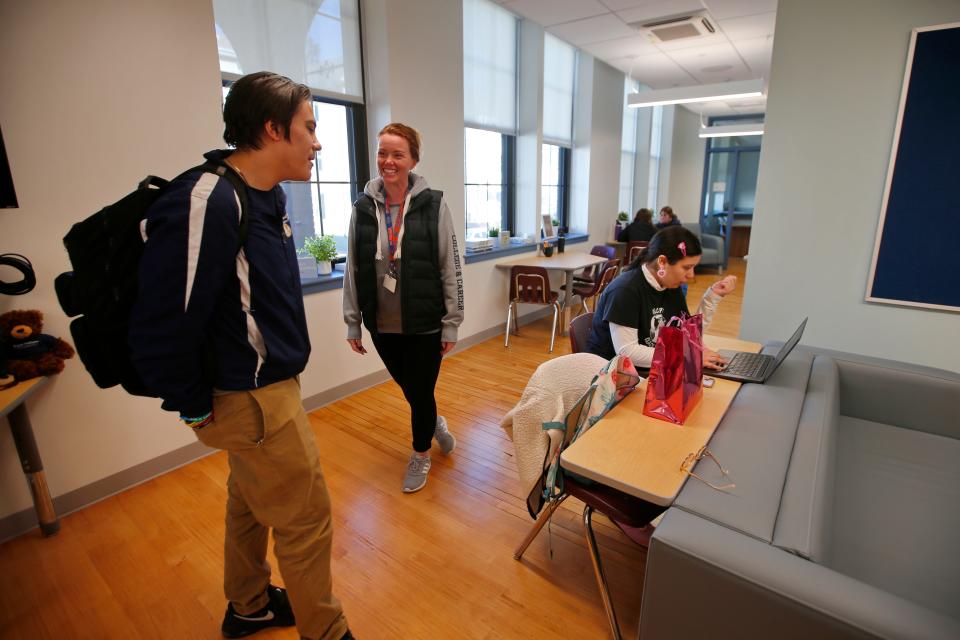 Ashley McPherson, director of the College & Career Center, speaks with students at the Joan & Irwin Jacobs Center for STEAM Education at Global Learning Charter Public School in New Bedford.