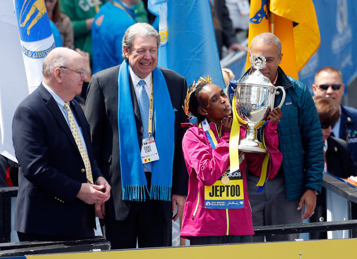 BOSTON, MA - APRIL 21:  Rita Jeptoo of Kenya celebrates with the trophy after winning the 118th Boston Marathon on April 21, 2014 in Boston, Massachusetts.  (Photo by Jim Rogash/Getty Images)