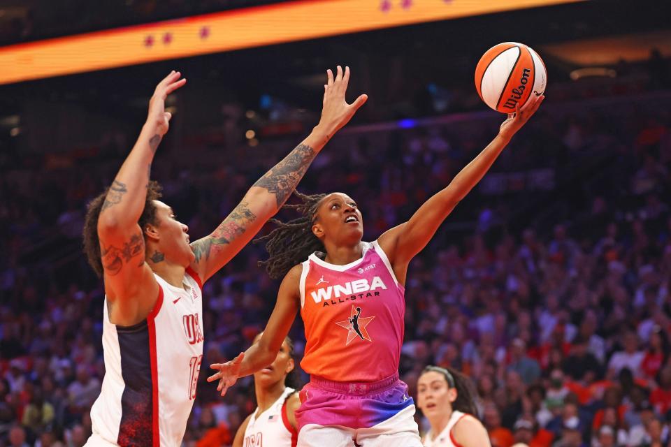 Jul 20, 2024; Phoenix, AZ, USA; Team WNBA guard Kelsey Mitchell (0) shoots for the basket as USA Women's National Team forward Brittney Griner (15) defends during the first half at Footprint Center. Mandatory Credit: Mark J. Rebilas-USA TODAY Sports ORG XMIT: IMAGN-885052 ORIG FILE ID: 20240720_tdc_su5_0277.JPG