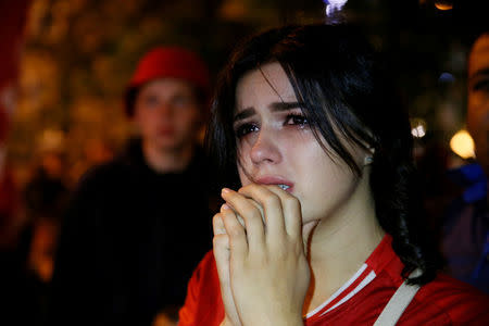 Soccer Football - Champions League Final - Real Madrid v Liverpool - Kiev, Ukraine - May 26, 2018 Liverpool fan looks dejected after watching the match on a television screen outside the stadium REUTERS/Valentyn Ogirenko