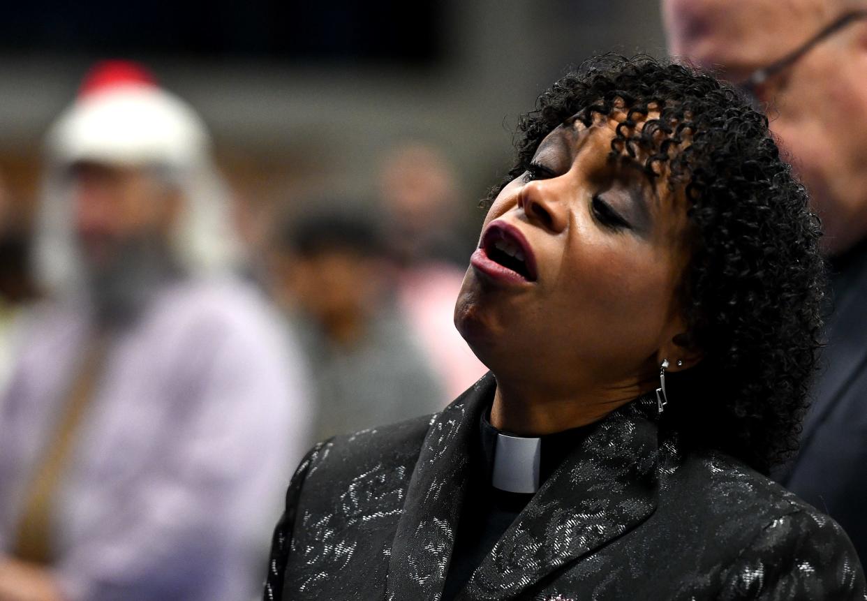 Rev. Dr. Debora Jackson sings Monday along with "We Shall Overcome" at the conclusion of the Martin Luther King, Jr. Community Breakfast at Quinsigamond Community College.