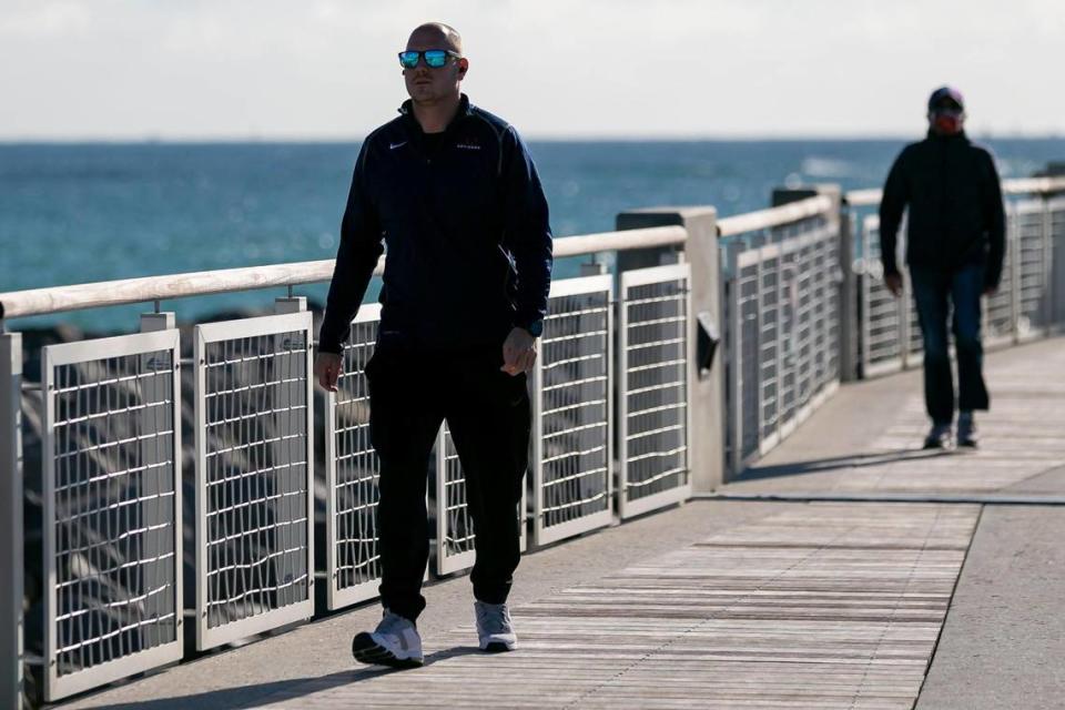 Igor Lozo visits South Pointe Park Pier in Miami Beach after temperatures dipped into the mid 50s and low 60s across South Florida on Wednesday, December 2, 2020.