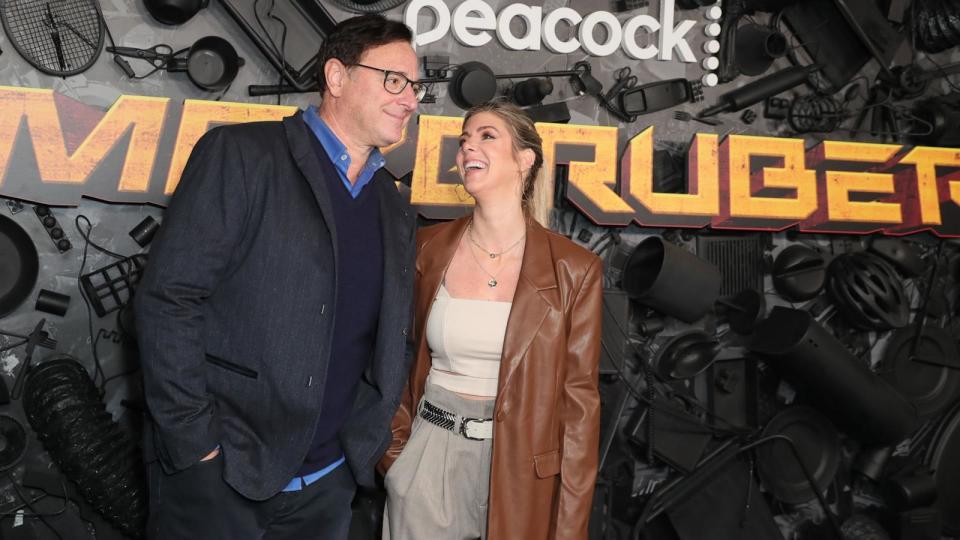 PHOTO: (L-R) Kelly Rizzo and Bob Saget attend the red carpet premiere and party for Peacock's new comedy series 'MacGruber' at California Science Center on Dec. 08, 2021 in Los Angeles. (Leon Bennett/Getty Images, FILE)