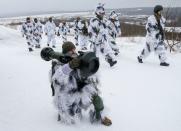 A Ukrainian service member holds a NLAW missile during drills in the Lviv region