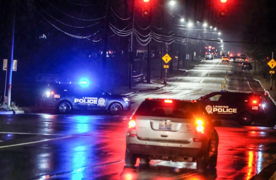 Lansing Police block off Aurelius Road from Jolly to Cavanaugh roads after a Lansing police officer or officers shot someone on Thursday, Jan. 5, 2023.