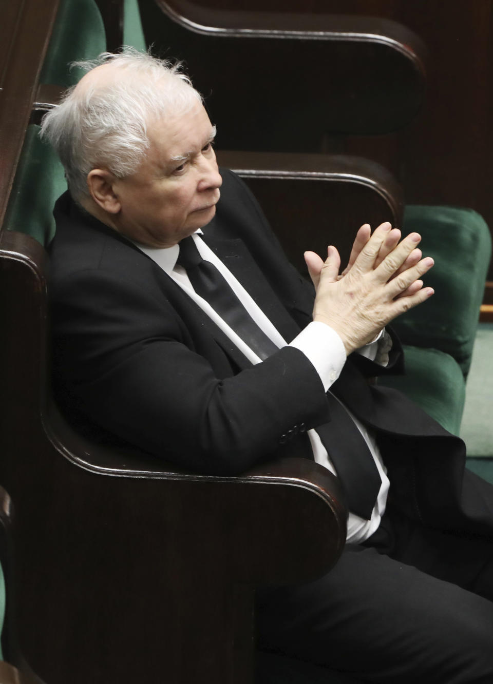 Jaroslaw Kaczynski, leader of Poland's ruling conservative Law and Justice party, takes part in a parliamentary session in Warsaw, Poland, Monday, April 6, 2020. Uncertainty over whether Poland will hold a postal presidential election during the COVID-19 coronavirus pandemic deepened Monday after a deputy prime minister resigned, leaving Kaczynski's ruling party without enough votes to approve an exclusively mail-in ballot. (AP Photo/Czarek Sokolowski)