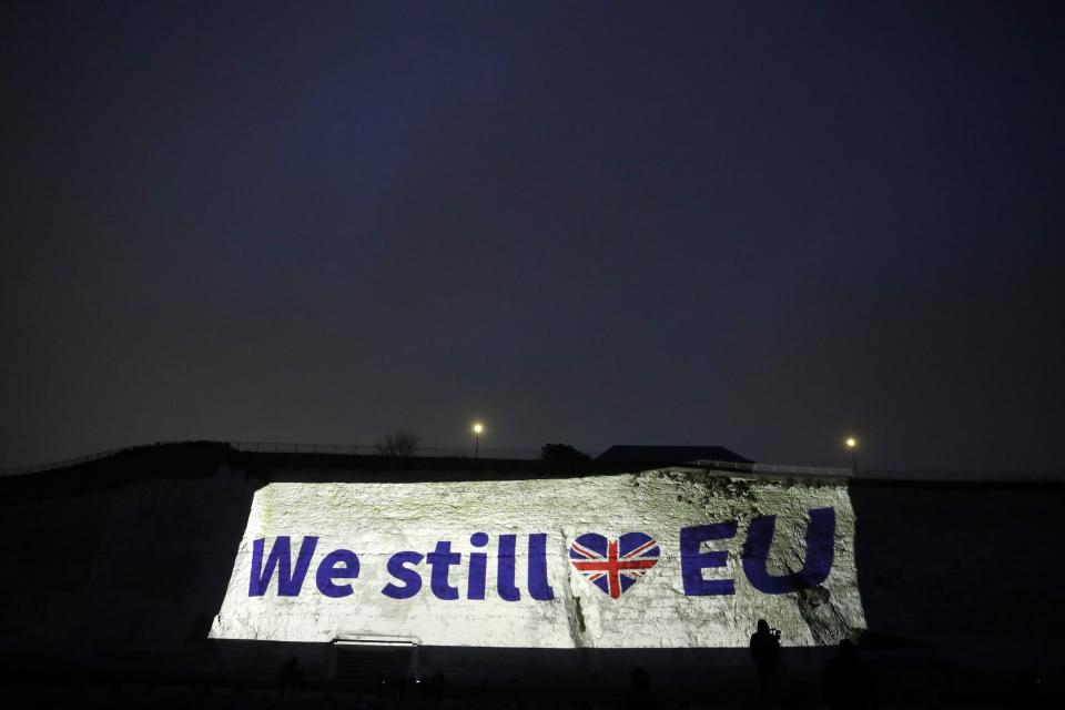 A projection appears on a cliff in Ramsgate, southern England, Friday, Jan. 31, 2020. Britain officially leaves the European Union on Friday after a debilitating political period that has bitterly divided the nation since the 2016 Brexit referendum. (AP Photo/Matt Dunham)