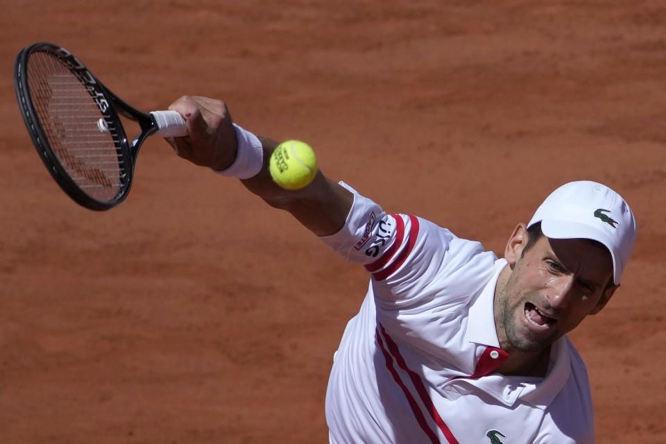 Serbia's Novak Djokovic serves to Stefanos Tsitsipas of Greece during their final match of the French Open tennis tournament at the Roland Garros stadium Sunday, June 13, 2021 in Paris. (AP Photo/Christophe Ena)