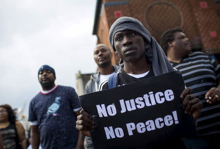 People gather to march in Baltimore, Maryland April 30, 2015. REUTERS/Eric Thayer