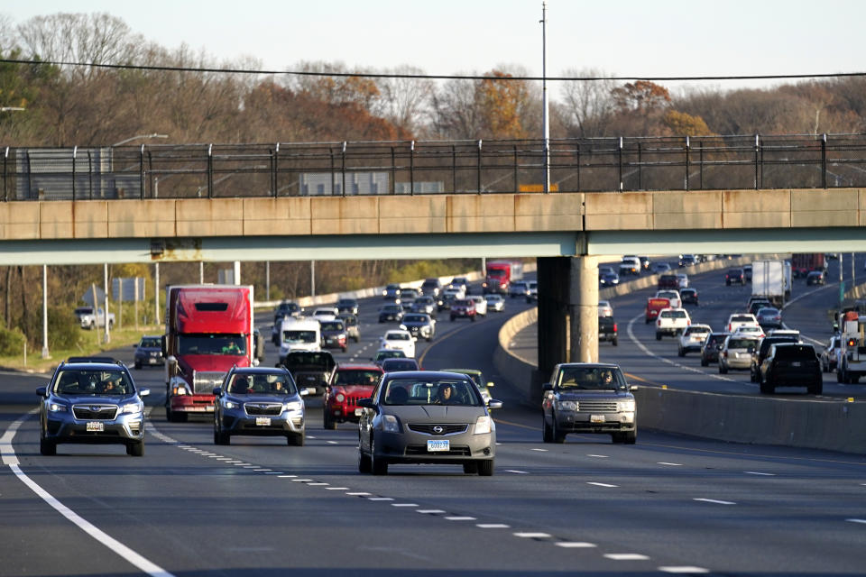 Vehicles travel westbound on Interstate 695, Tuesday, Nov. 24, 2020, in Parkville, Md. (AP Photo/Julio Cortez)