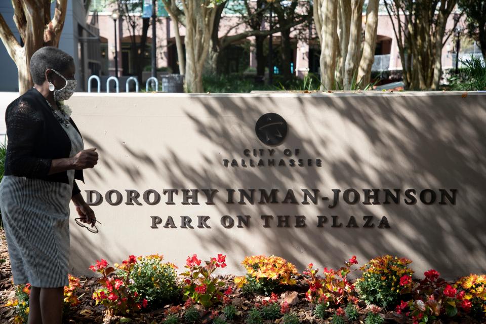 Former mayor Dorothy "Dot" Inman-Johnson gets a first look at the sign dedicating the park in Kleman Plaza to her Monday, Oct. 26, 2020. 