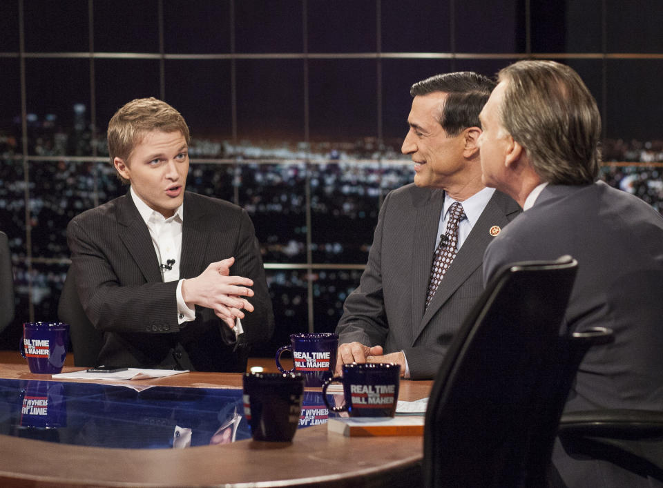 This Jan. 31, 2014 photo released by HBO shows MSNBC Host Ronan Farrow, left, speaking with Rep. Darrell Issa, R-Calif., and host Bill Maher, on "Real Time with Bill Maher," in Los Angeles. Farrow's sister Dylan Farrow, the adopted daughter of Allen and Mia Farrow, penned an emotional open letter, accusing Hollywood of callously lionizing Allen, who she claims abused her. The letter revived in stunning detail an allegation more than two decades old. Ronan Farrow tweeted a harsh response after Allen was awarded the Cecil B. DeMille award at the Golden Globes in January. (AP Photo/HBO, Janet Van Ham)