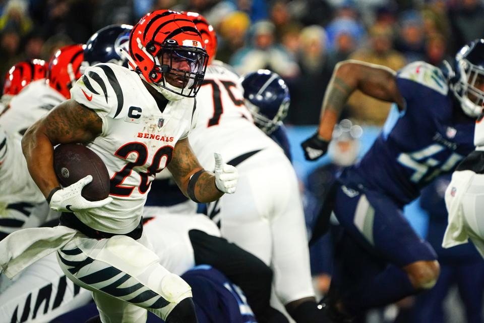 Cincinnati Bengals running back Joe Mixon (28) carries the ball in the fourth quarter during an NFL divisional playoff football game against the Tennessee Titans, Saturday, Jan. 22, 2022, at Nissan Stadium in Nashville. The Cincinnati Bengals defeated the Tennessee Titans, 19-16, to advance to the AFC Championship game. 