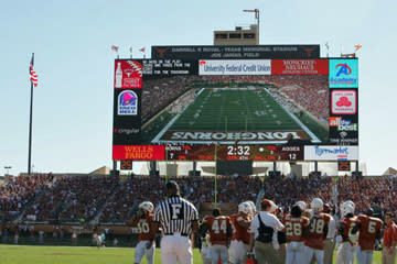 <b>"Godzillatron," seen here in a game between archrivals Texas and Texas A&M on Nov. 24, 2006, looms over the Longhorns football team.</b> Ronald Martinez/<a class="link " href="http://www.gettyimages.com" rel="nofollow noopener" target="_blank" data-ylk="slk:Getty Images;elm:context_link;itc:0;sec:content-canvas">Getty Images</a>