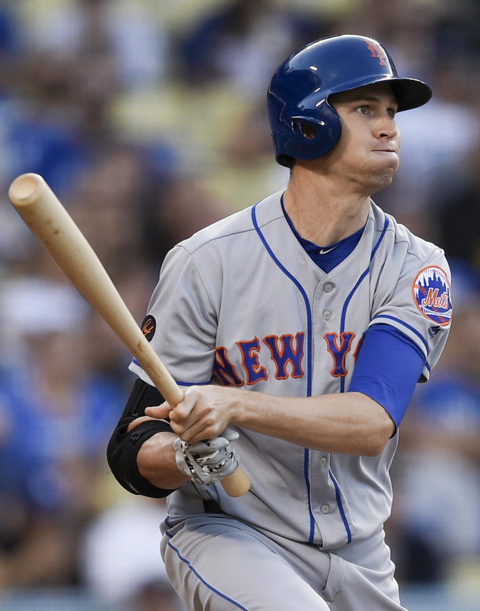 New York Mets' Jacob deGrom follows through on a swing for an RBI single during the fifth inning of a baseball game against the Los Angeles Dodgers in Los Angeles, Monday, Sept. 3, 2018. (AP Photo/Kelvin Kuo)