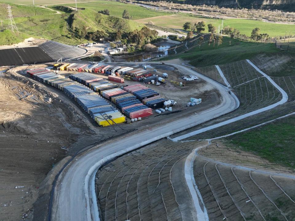 An aerial view of roughly 100 metal storage containers.