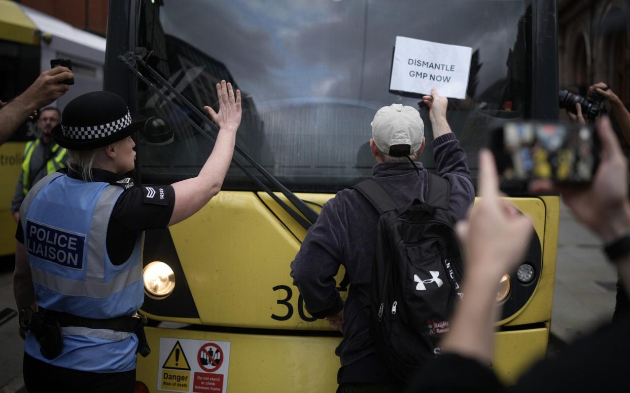 Protesters block the tram tracks