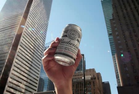 A promoter poses with a can of Budweiser Prohibition Brew, a non-alcoholic beer, while giving away free samples in Toronto, Ontario, Canada June 23, 2016. REUTERS/Chris Helgren