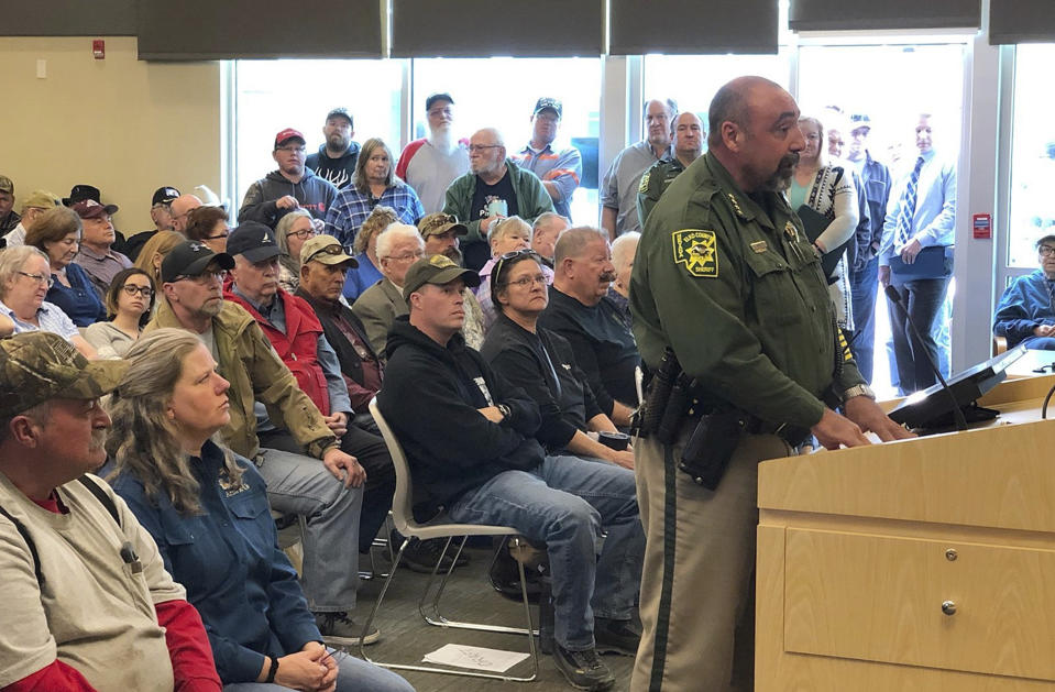 FILE - In this Wednesday, March 20, 2019, file photo, An overflowing crowd packs the Elko County Commission chamber as Elko County Sheriff Aitor Narvaiza presents his case for the county to declare a "Second Amendment sanctuary" in Elko, Nev. A gun control lobbying organization is adding Nevada to efforts to show gun rights groups including the National Rifle Association are behind a "Second Amendment sanctuary" drive in several states. The Brady advocacy group said Tuesday, April "16, 2019, it's filing public records requests for communications in Douglas, Elko, Lyon and Nye county, and with Eureka, Pershing and Nye county sheriff's. (Tim Burmeister/Elko Daily Free Press via AP, File)