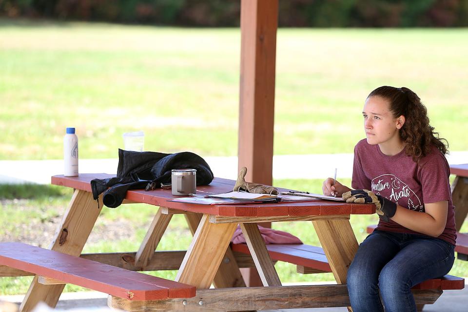 Alyssa Budd, 15, of Troop 424 takes notes for her Eagle Scout project at the Marshfield Boys and Girls Club on Saturday, Oct 15, 2022.