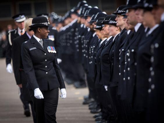 New recruits to the Metropolitan Police Service are inspected by Superintendent Robyn Williams during their passing out parade at Hendon Training Centre on 13 March 2015 in London ( Rob Stothard/Getty Images)