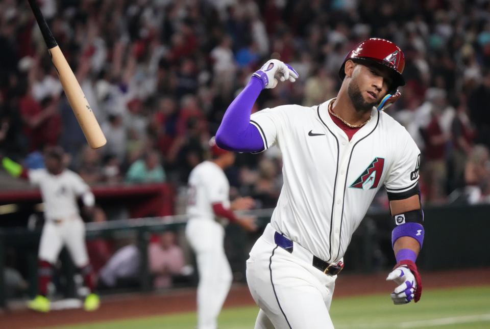 Arizona Diamondbacks Lourdes Gurriel Jr. (12) flips his bat after hitting a 2-run home run against the Colorado Rockies on Opening Day at Chase Field.