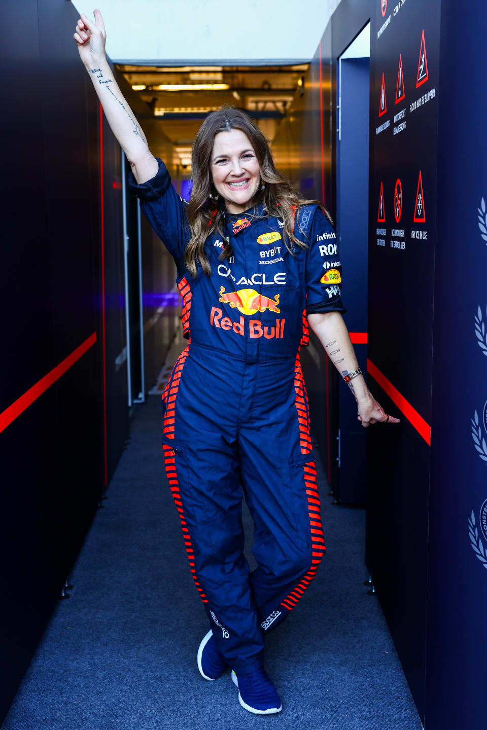 AUSTIN, TEXAS - OCTOBER 19: Drew Barrymore poses for a photo in the Red Bull Racing garage during previews ahead of the F1 Grand Prix of United States at Circuit of The Americas on October 19, 2023 in Austin, Texas. (Photo by Mark Thompson/Getty Images)