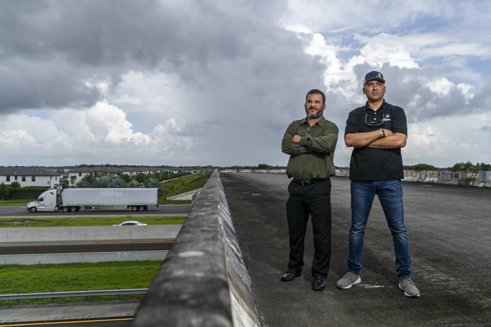 Eduardo Lavin, 48, left, and Eddie Santiesteban, 48, five years ago stand on Northwest 154 Street in Hialeah advocating for the opening of the bridge that connects their neighborhood to Miami Lakes. Lavin and Santiesteban. The opening happened in 2023.