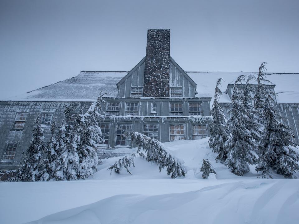 exterior of timberline lodge covered in snow