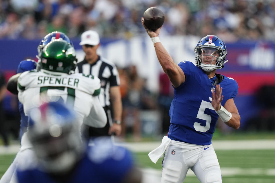 New York Giants quarterback Tommy DeVito (5) passes the ball during the first half of an NFL preseason football game against the New York Jets, Saturday, Aug. 26, 2023, in East Rutherford, N.J. (AP Photo/Frank Franklin II)