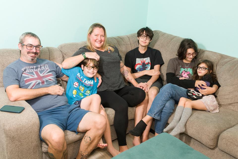 The Cousins family of Orange County, Florida, are six of the plaintiffs in a suit that challenges the constitutionality of Florida's Parental Rights in Education bill, which LGBTQ+ advocates have dubbed the "Don't Say Gay" bill. Matt and Jennifer are pictured here with their children, identified in the lawsuit by their initials, from left: third-grader M.C., ninth-grader N.C., seventh-grader S.C., and first-grader P.C.