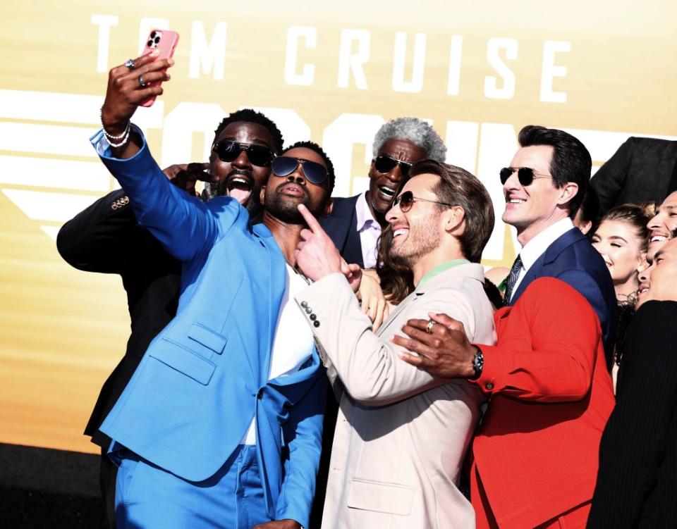 Jay Ellis takes a group selfie with Bashir Salahuddin, Charles Parnell, Glen Powell, and Joseph Kosinski at the premiere of “Top Gun: Maverick” - Credit: Christopher Polk for Variety