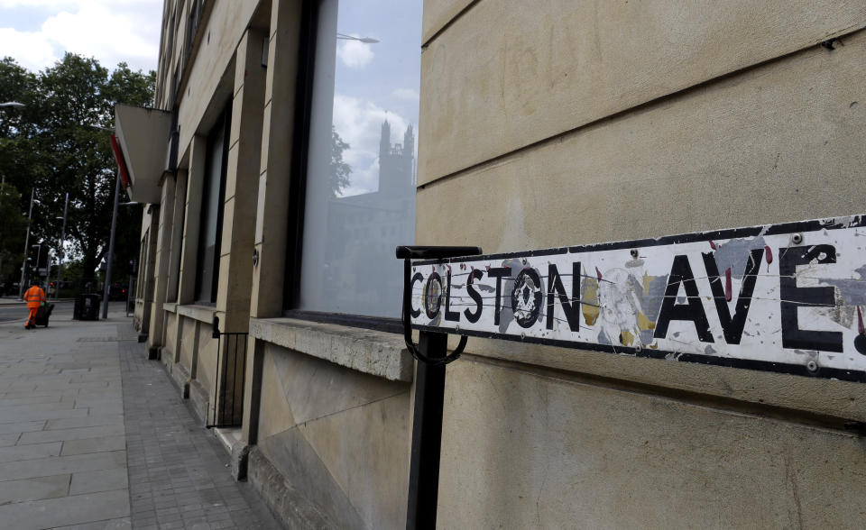 A road sign on Colston Avenue in Bristol, England, Monday, June 8, 2020. The toppling of the statue of Edward Colston on Sunday at a Black Lives Matter demo was greeted with joyous scenes, recognition of the fact that he was a notorious slave trader — a badge of shame in what is one of Britain’s most liberal cities. (AP Photo/Kirsty Wigglesworth)