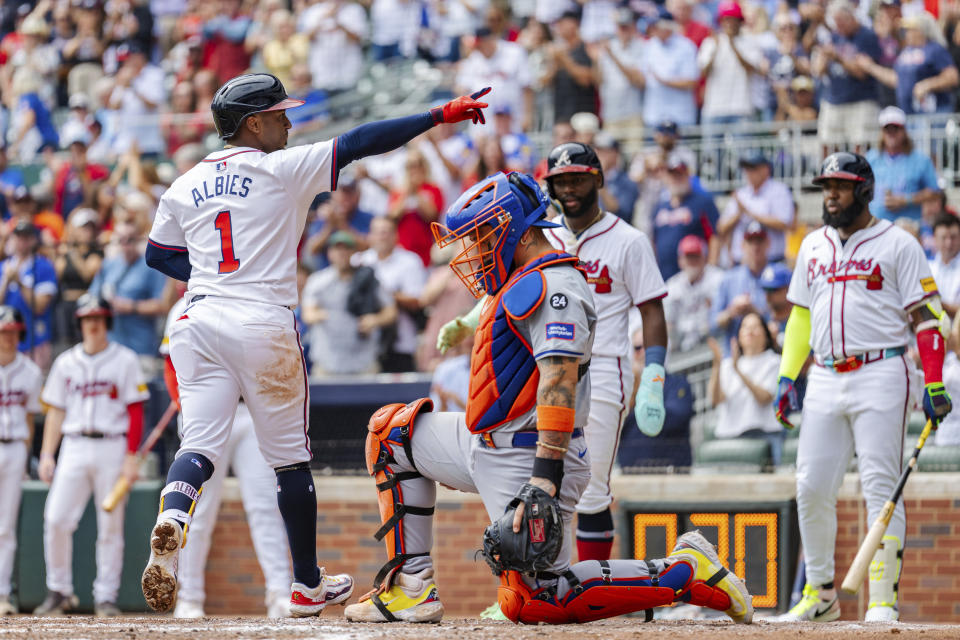 Ozzie Albies hit a two-run home run in Monday's first game. (AP Photo/Jason Allen)