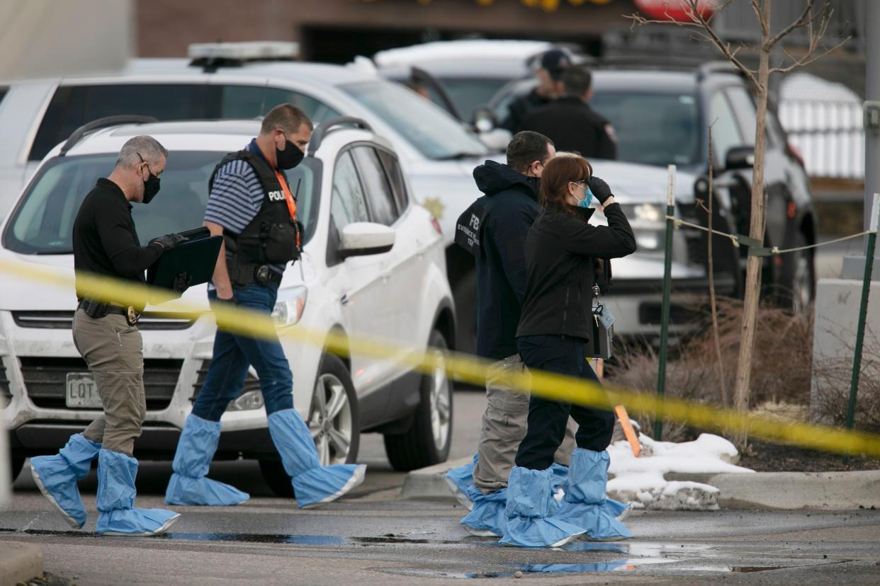 Police work on the scene outside of a King Soopers grocery store where a shooting took place Monday, March 22, 2021, in Boulder, Colo.