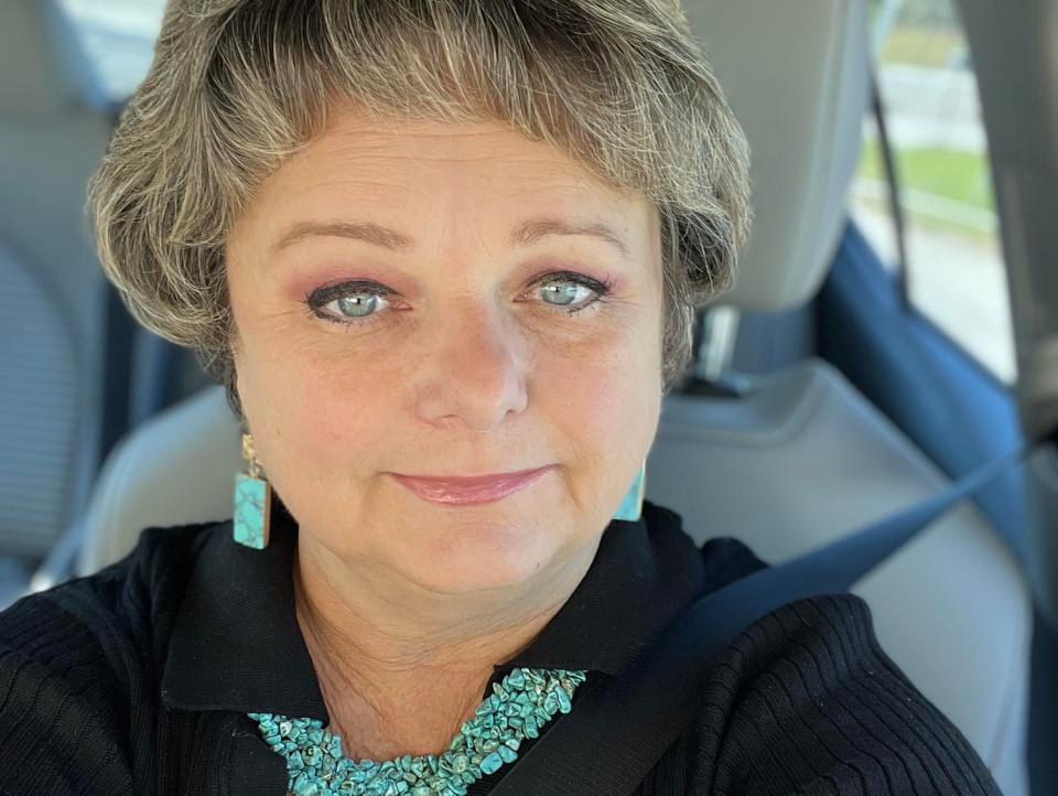 A woman in a car taking a selfie