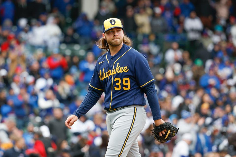Milwaukee Brewers starting pitcher Corbin Burnes (39) walks back to dugout after the third inning against the Chicago Cubs at Wrigley Field on March 30, 2023.