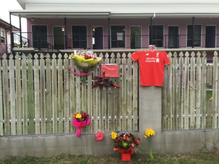 Flowers and messages are placed on a fence outside the hostel where British backpacker Mia Ayliffe-Chung, 21, was stabbed and killed on August 23, 2016, in Home Hill, a rural town in Australia's north Queensland state