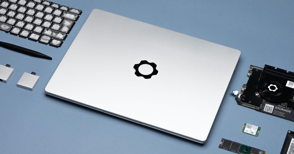  A lifestyle image of the Framework laptop surrounded by replaceable components  