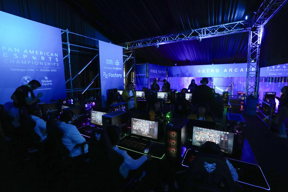 Gamers from Argentina and Colombia compete during the Esports championship at the Pan American Games in Santiago, Chile, Thursday, Nov. 2, 2023. (AP Photo/Matias Delacroix)