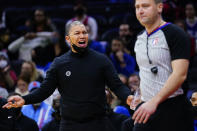 Los Angeles Clippers' Tyronn Lue yells to referee Gediminas Petraitis during the first half of an NBA basketball game against the Philadelphia 76ers, Friday, Jan. 21, 2022, in Philadelphia. (AP Photo/Matt Slocum)