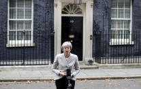 Britain's Prime Minister Theresa May makes a statement outside 10 Downing Street, London, Thursday Nov. 22, 2018. Theresa May says Brexit deal's approval "is within our grasp" and she is determined to deliver it. (AP Photo/Kirsty Wigglesworth)